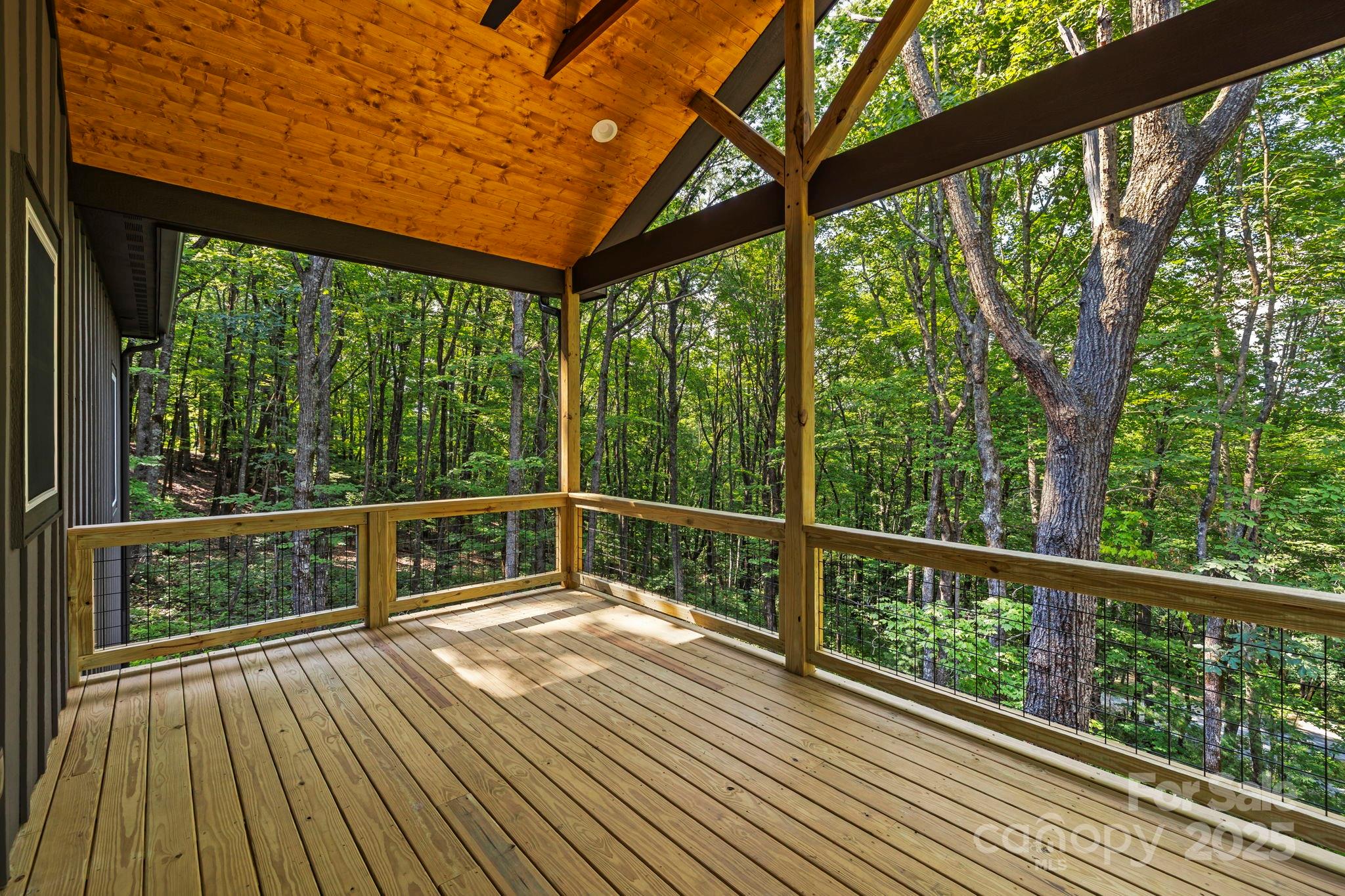 939 Rocky Mountain Road Lake Toxaway, NC 28747 - Photo 5 of 23 a view of balcony with wooden floor