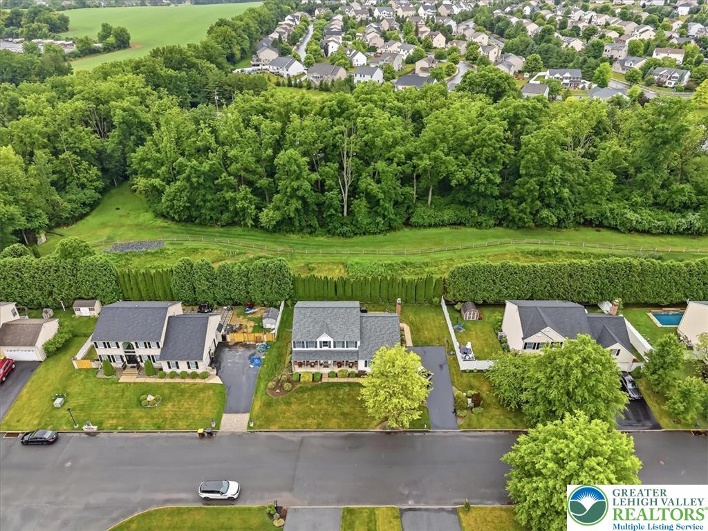 2011 Fieldview Drive Nazareth, PA 18064 - Photo 45 of 52 An aerial perspective reveals a vibrant neighborhood bordered by a lush, verdant treeline.