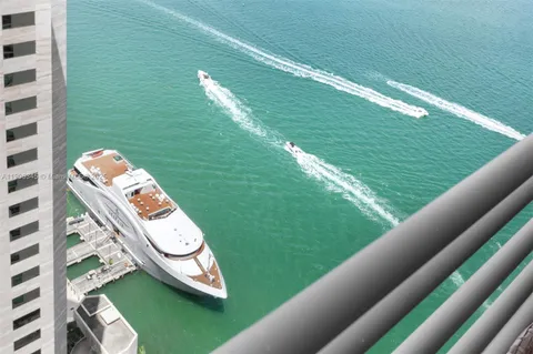 a view of a swimming pool with lawn chairs