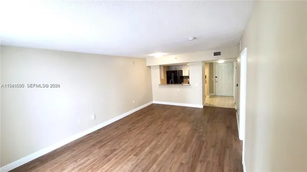 a view of a livingroom with wooden floor