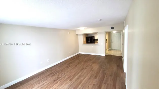 a view of a livingroom with wooden floor