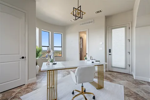 a view of a a dining room with furniture window and wooden floor
