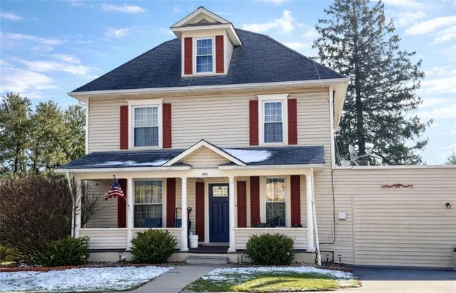 a front view of a house with garden