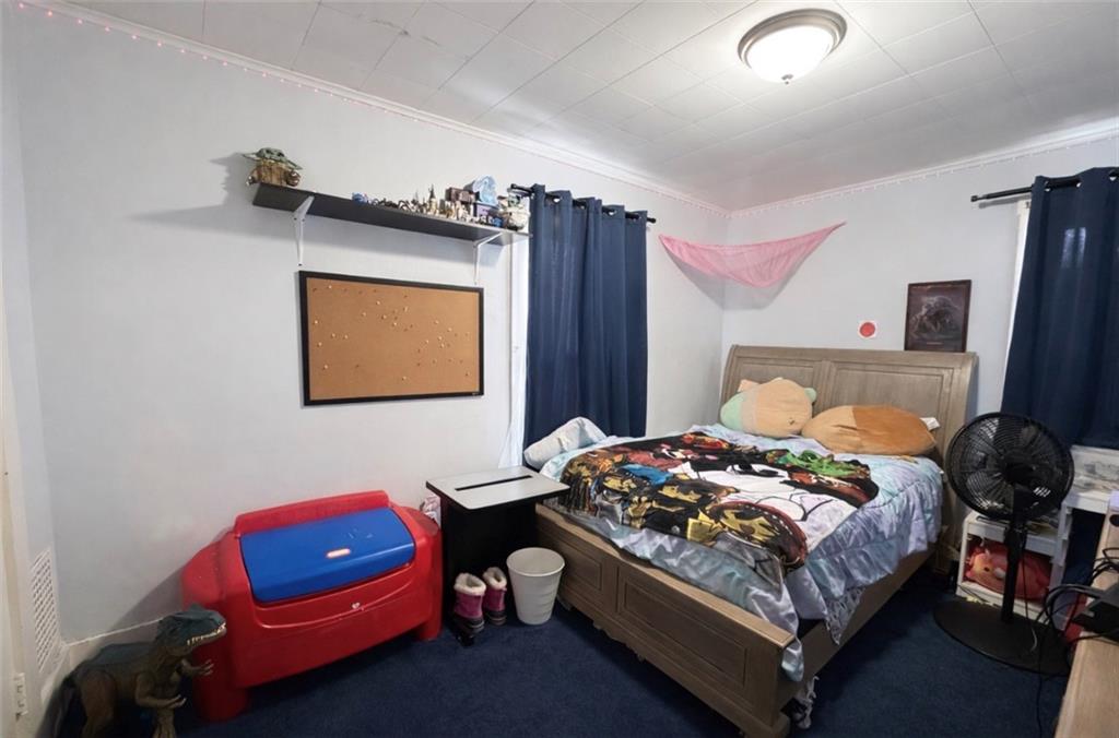 329 New Castle Street Slippery Rock, PA 16057 - Photo 11 of 27 a bedroom with a bed and a couch