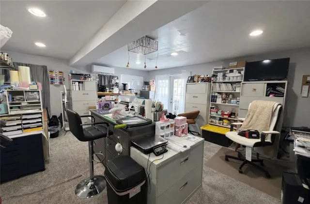 a view of a workspace with furniture