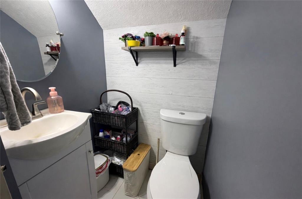329 New Castle Street Slippery Rock, PA 16057 - Photo 7 of 27 a bathroom with a toilet and a sink