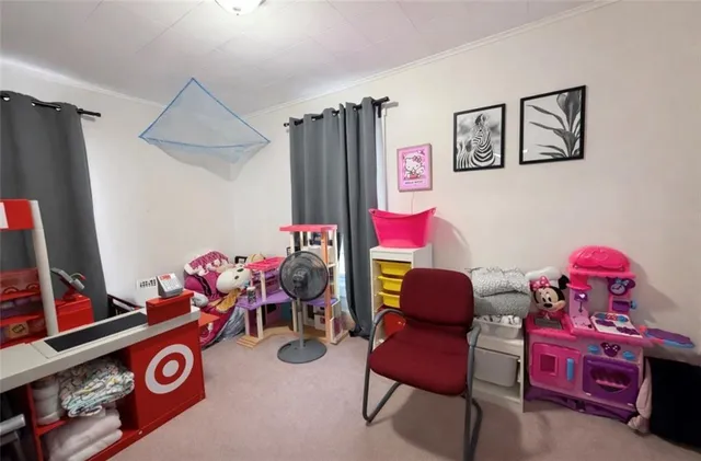 a living room with furniture and a chair