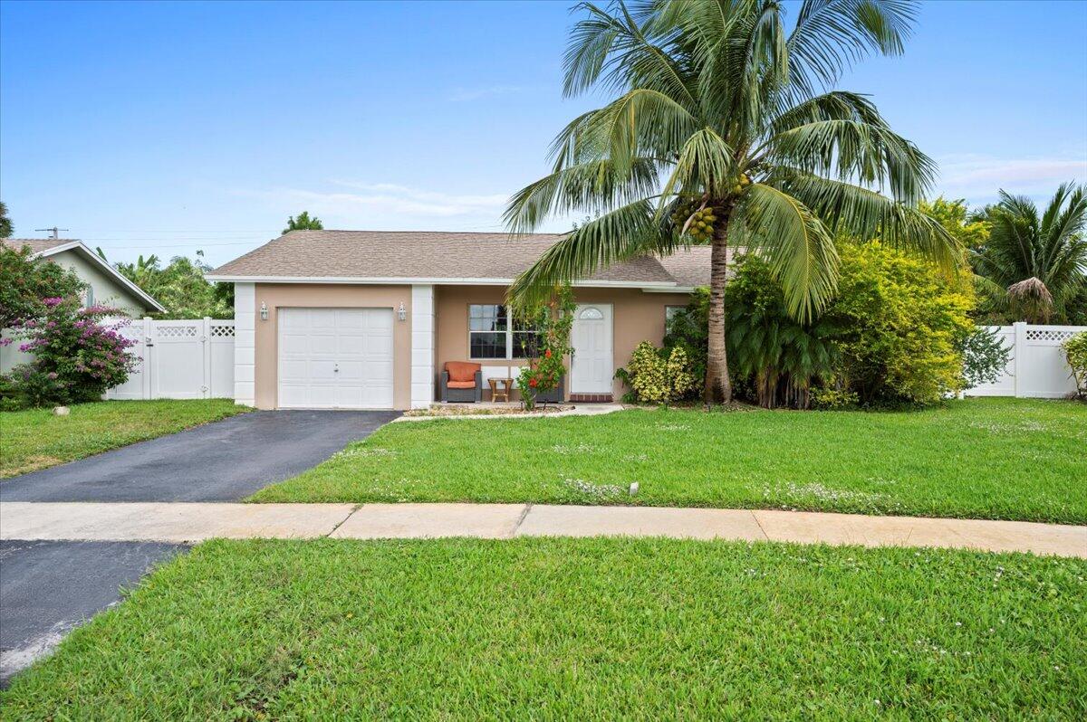 19309 Carolina Circle Boca Raton, FL 33434 - Photo 1 of 30 a front view of house with yard and green space