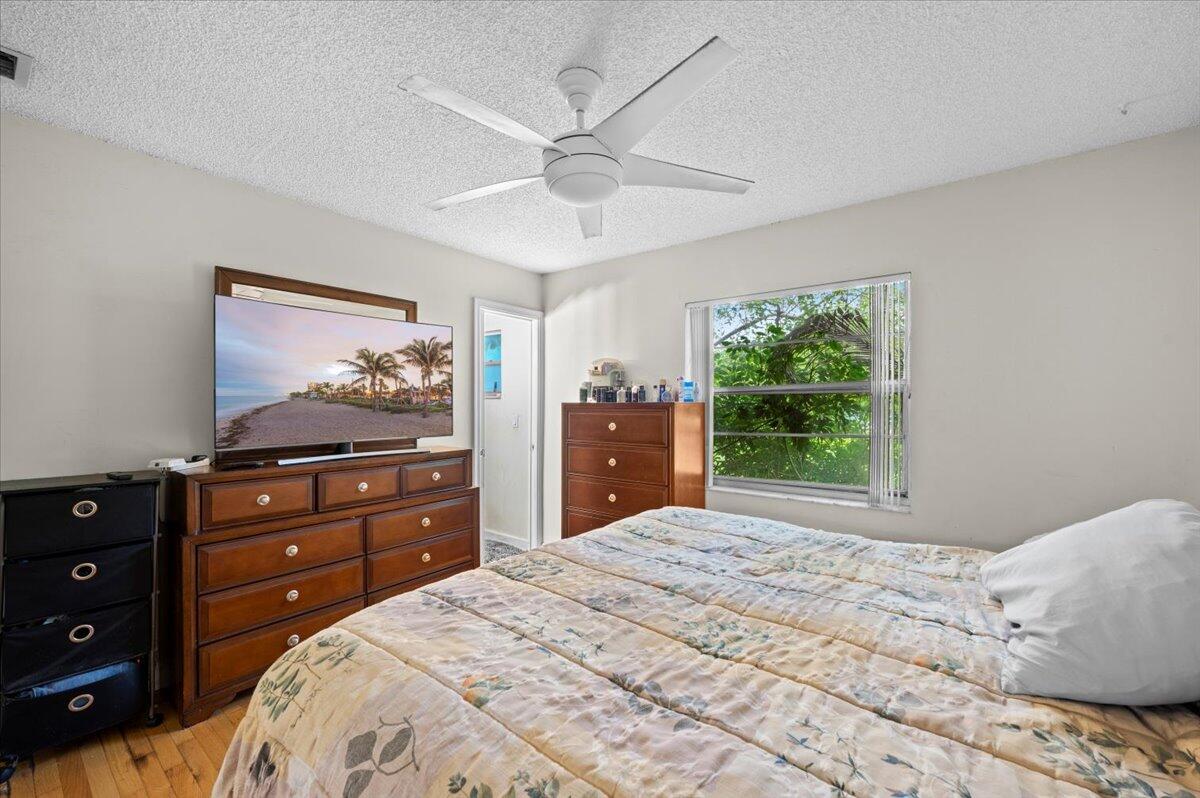 19309 Carolina Circle Boca Raton, FL 33434 - Photo 18 of 30 a bedroom with a bed and a dresser