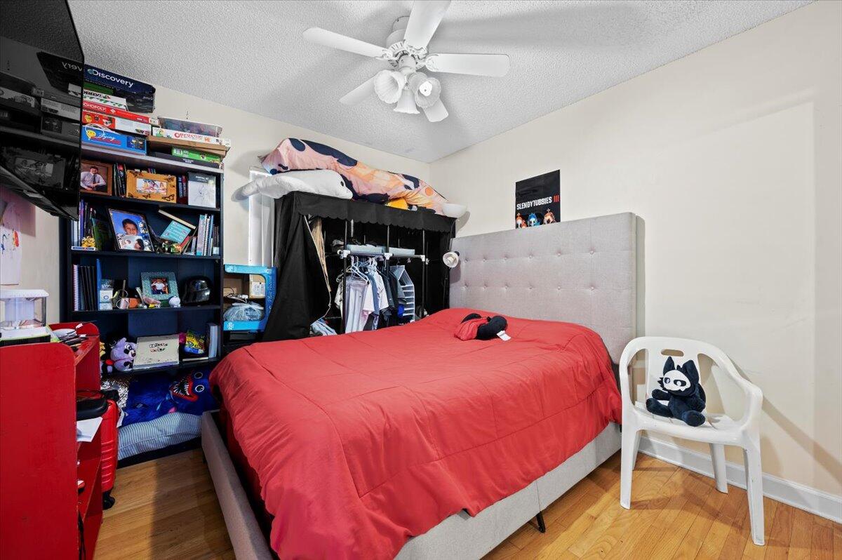 19309 Carolina Circle Boca Raton, FL 33434 - Photo 20 of 30 a bed room with a bed and a book shelf