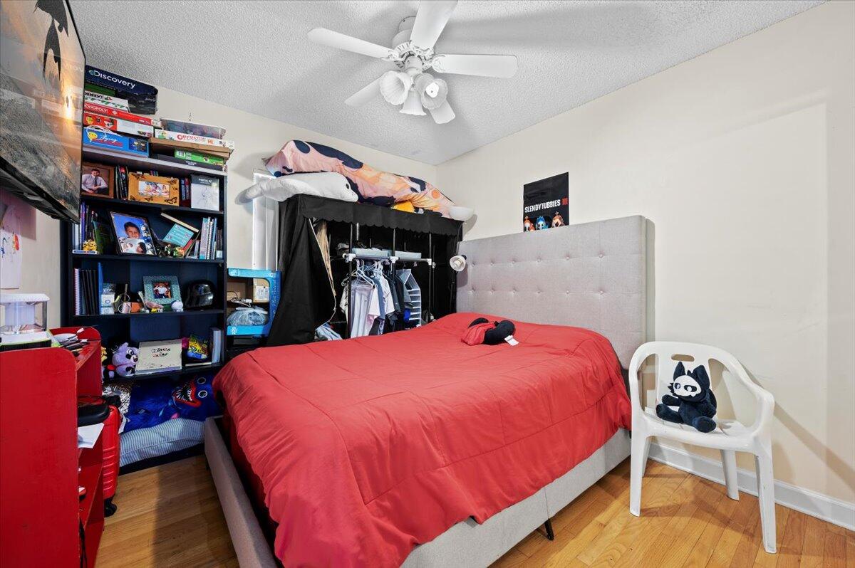 19309 Carolina Circle Boca Raton, FL 33434 - Photo 21 of 30 a bed room with a bed and a book shelf