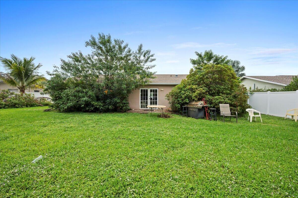 19309 Carolina Circle Boca Raton, FL 33434 - Photo 3 of 30 a view of a house with backyard and garden