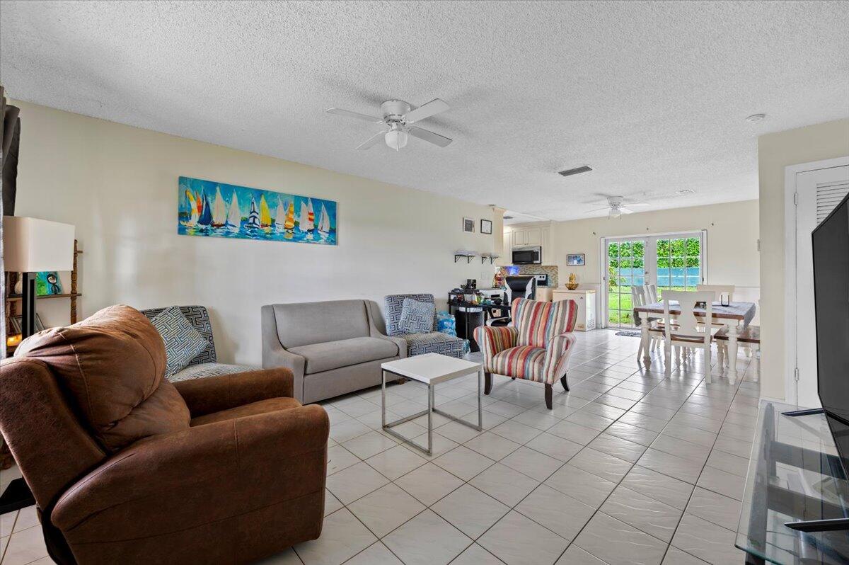 19309 Carolina Circle Boca Raton, FL 33434 - Photo 5 of 30 a living room with furniture and a large window