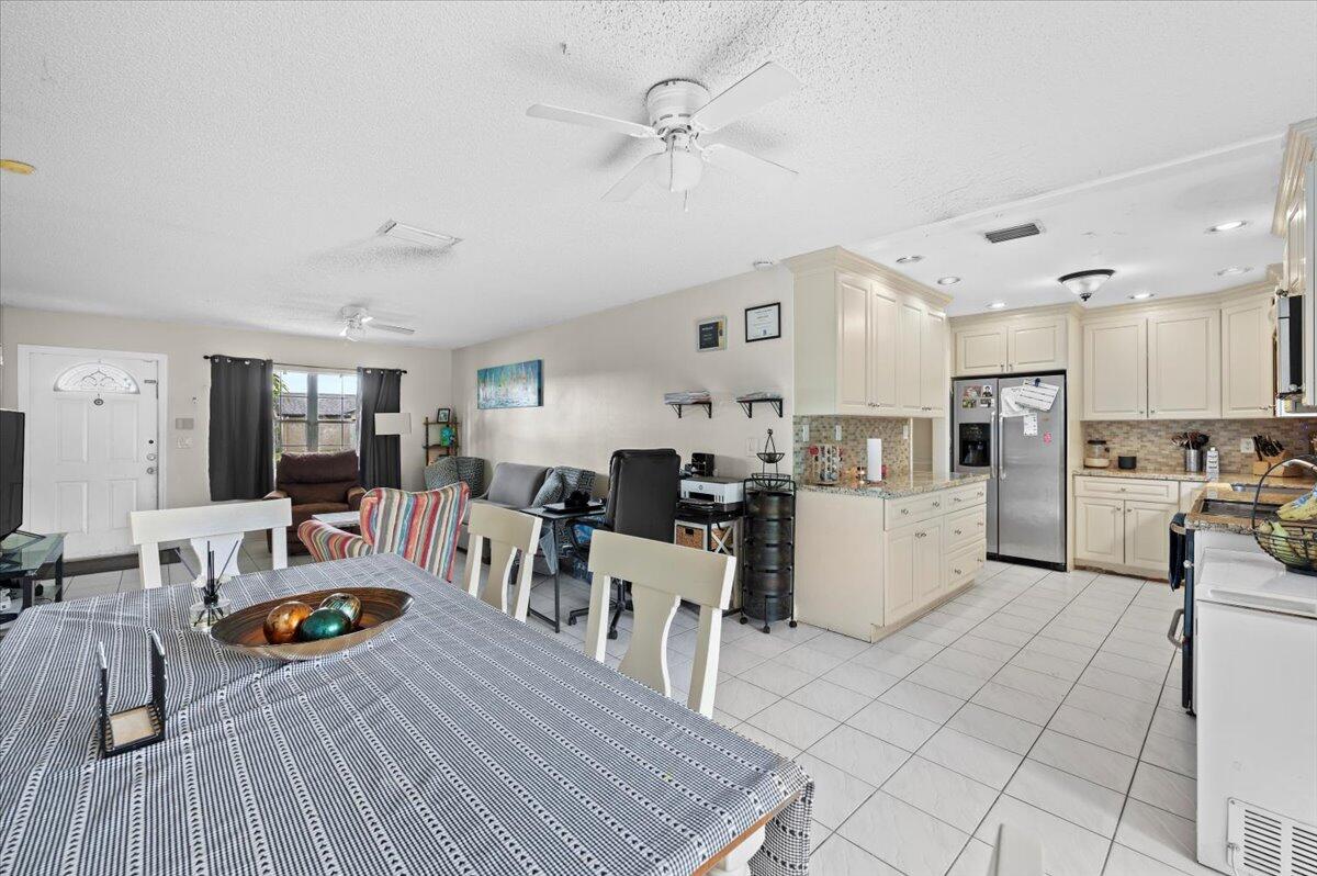 19309 Carolina Circle Boca Raton, FL 33434 - Photo 7 of 30 a living room with lots of furniture and kitchen view
