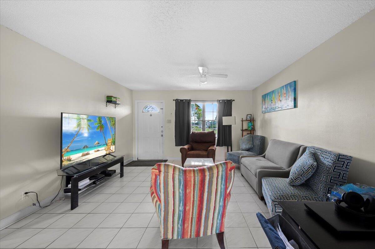 19309 Carolina Circle Boca Raton, FL 33434 - Photo 9 of 30 a living room with furniture and a flat screen tv