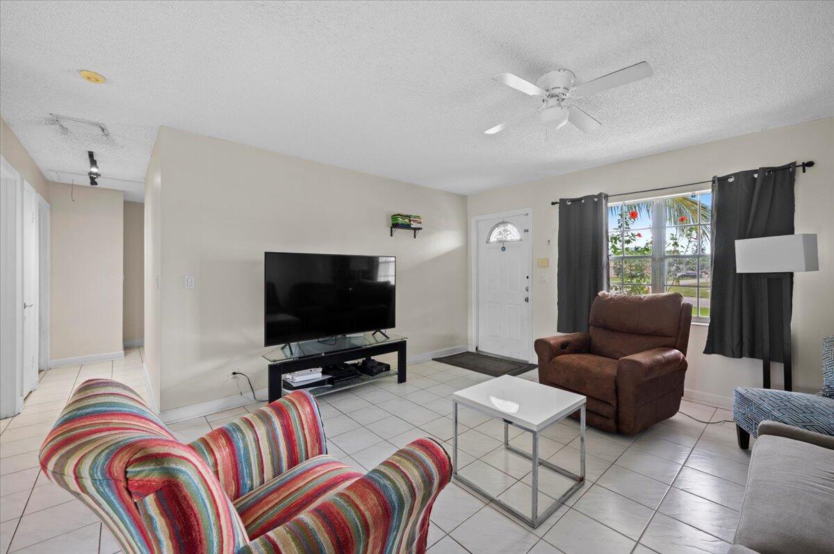 19309 Carolina Circle Boca Raton, FL 33434 - Photo 10 of 30 a living room with furniture and a flat screen tv