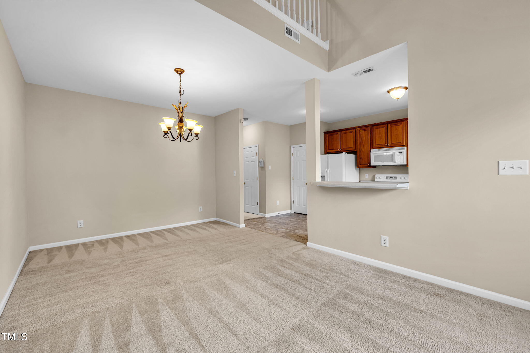 2737 Andover Glen Road Raleigh, NC 27604 - Photo 19 of 36 a view of a room with a chandelier fan and windows