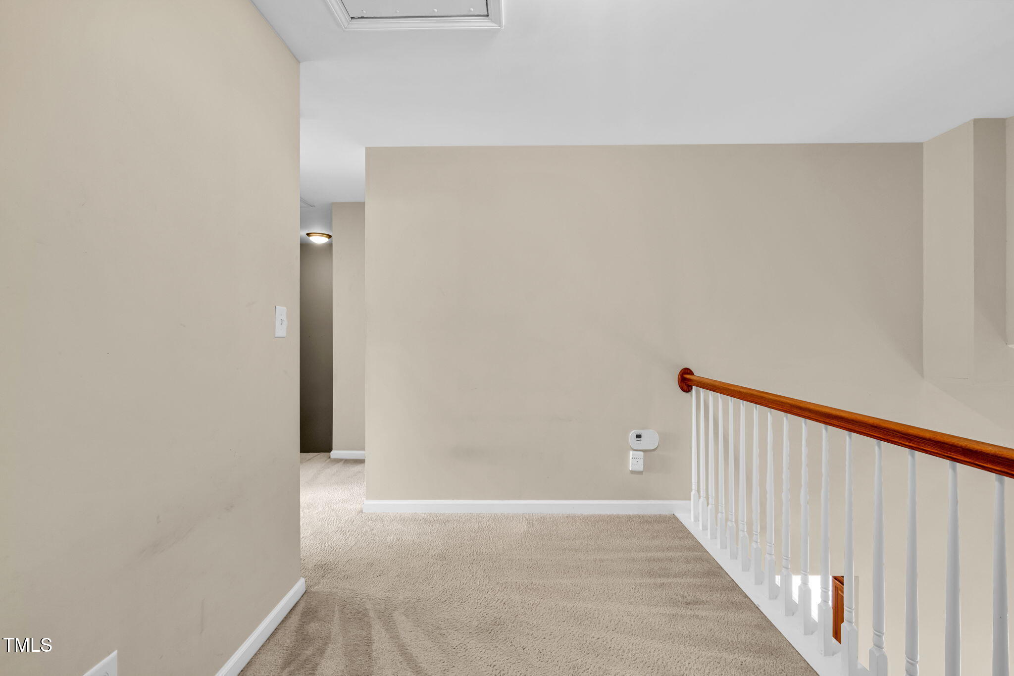 2737 Andover Glen Road Raleigh, NC 27604 - Photo 21 of 36 a view of a hallway with wooden floor