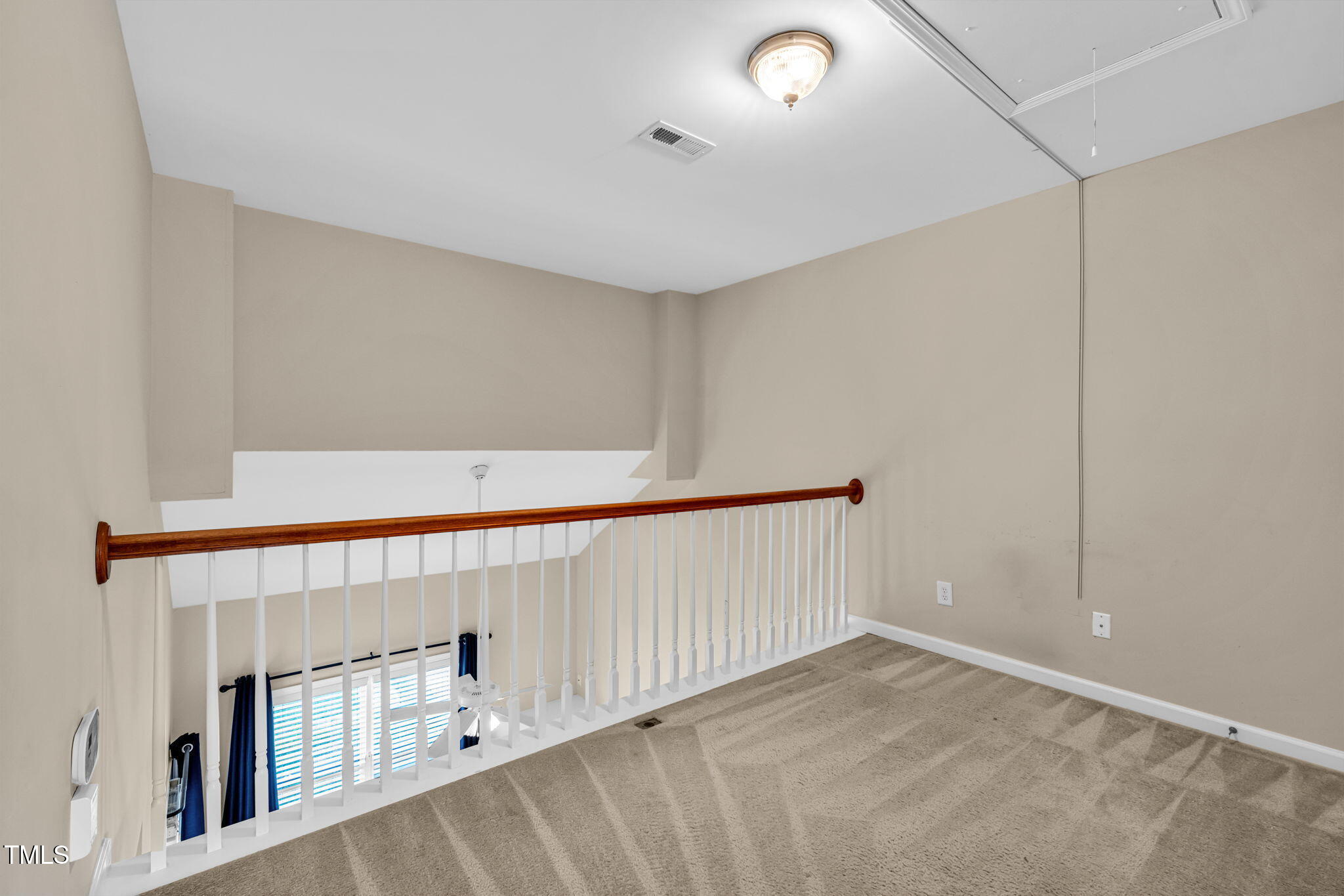 2737 Andover Glen Road Raleigh, NC 27604 - Photo 22 of 36 a view of an empty room with stairs