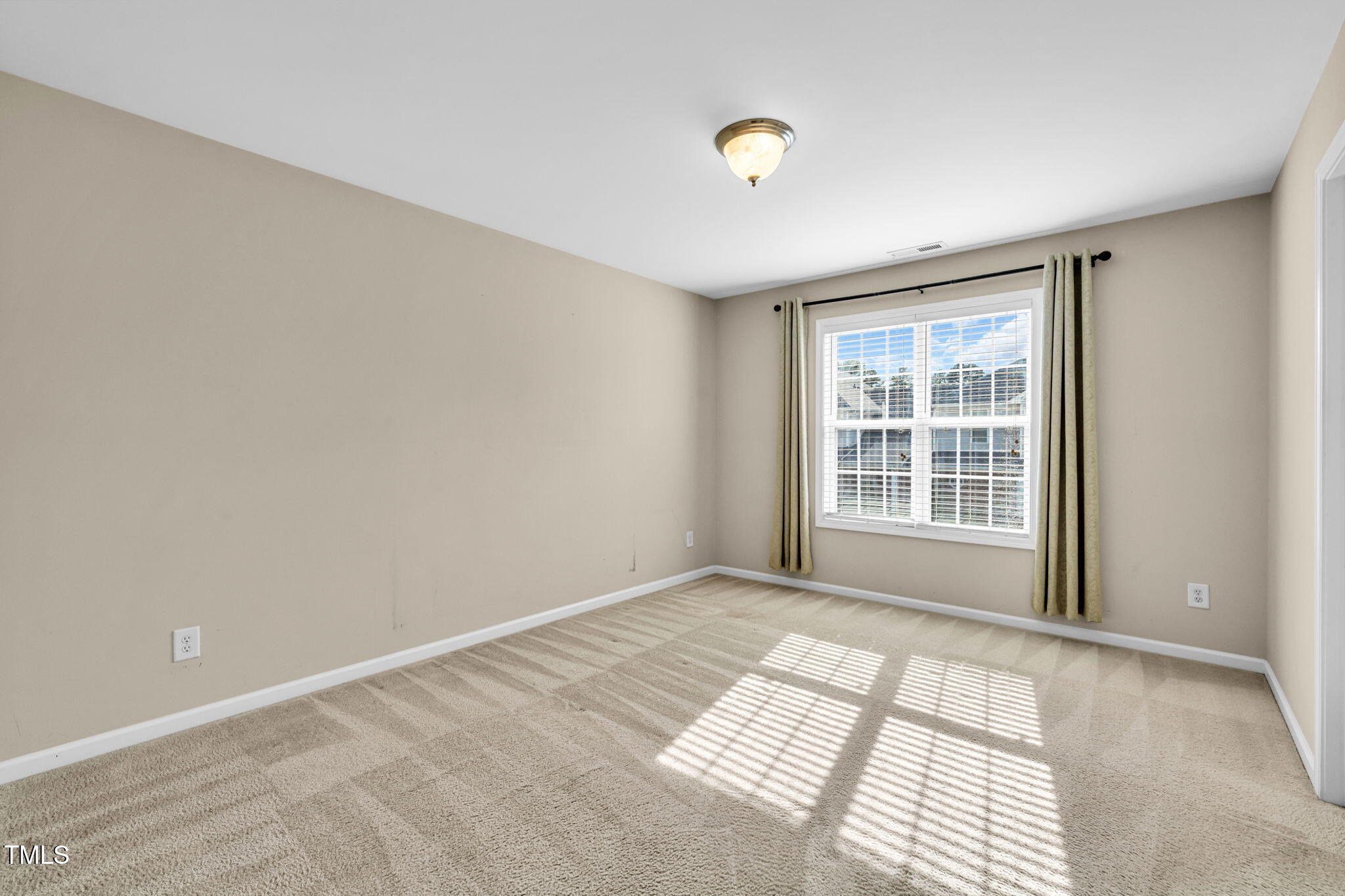 2737 Andover Glen Road Raleigh, NC 27604 - Photo 23 of 36 a view of an empty room and window