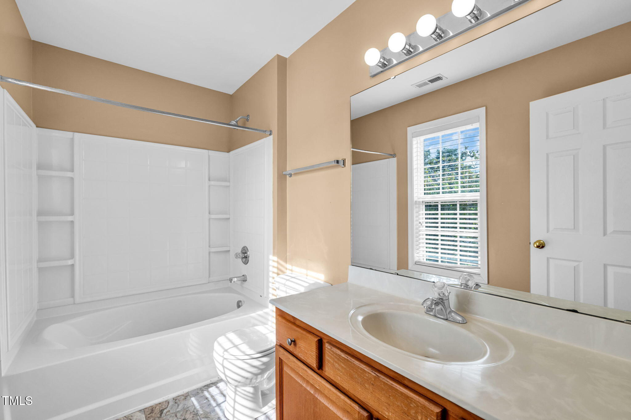 2737 Andover Glen Road Raleigh, NC 27604 - Photo 26 of 36 a bathroom with a granite countertop sink a toilet and shower