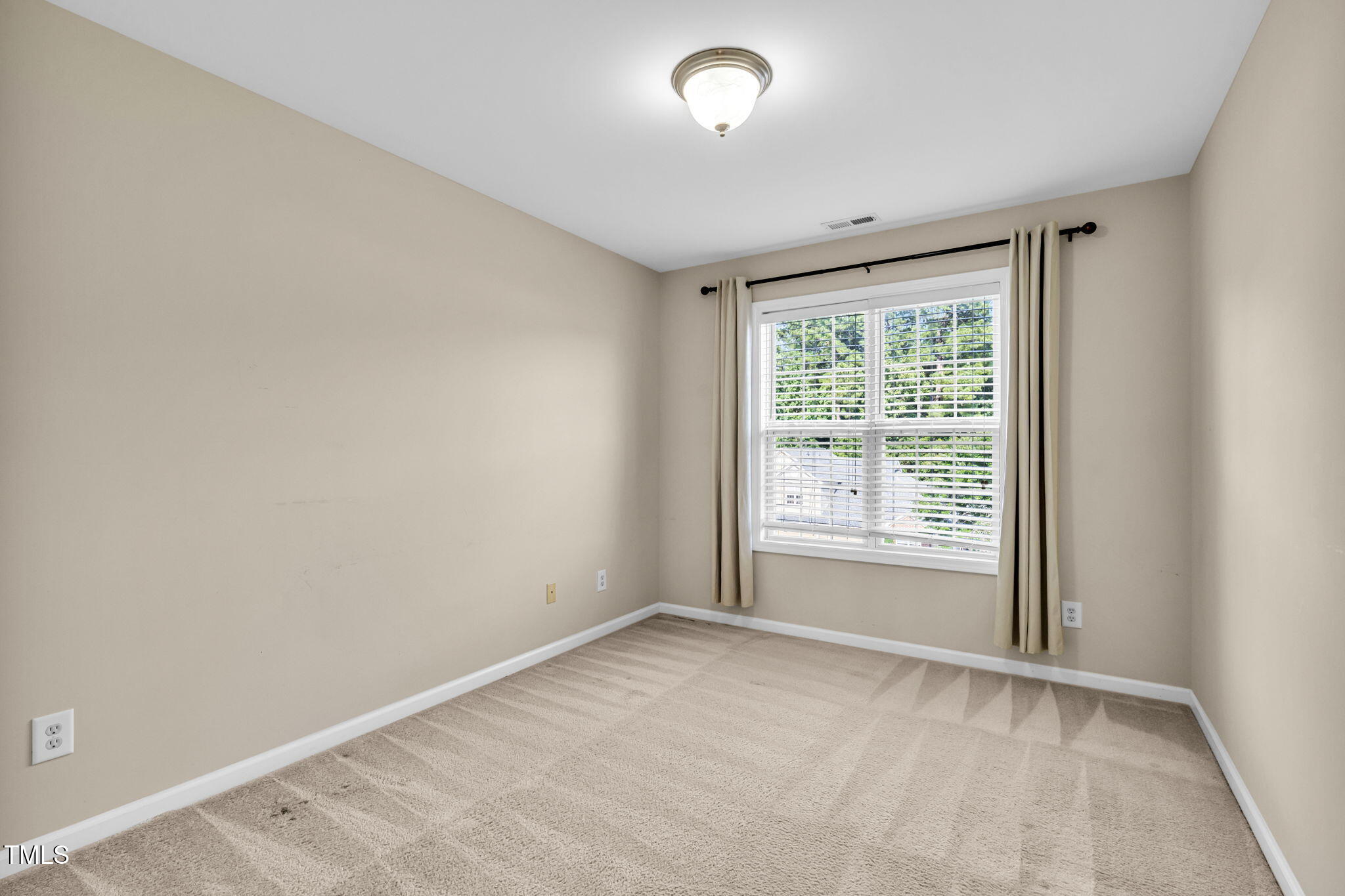 2737 Andover Glen Road Raleigh, NC 27604 - Photo 27 of 36 an empty room with a window