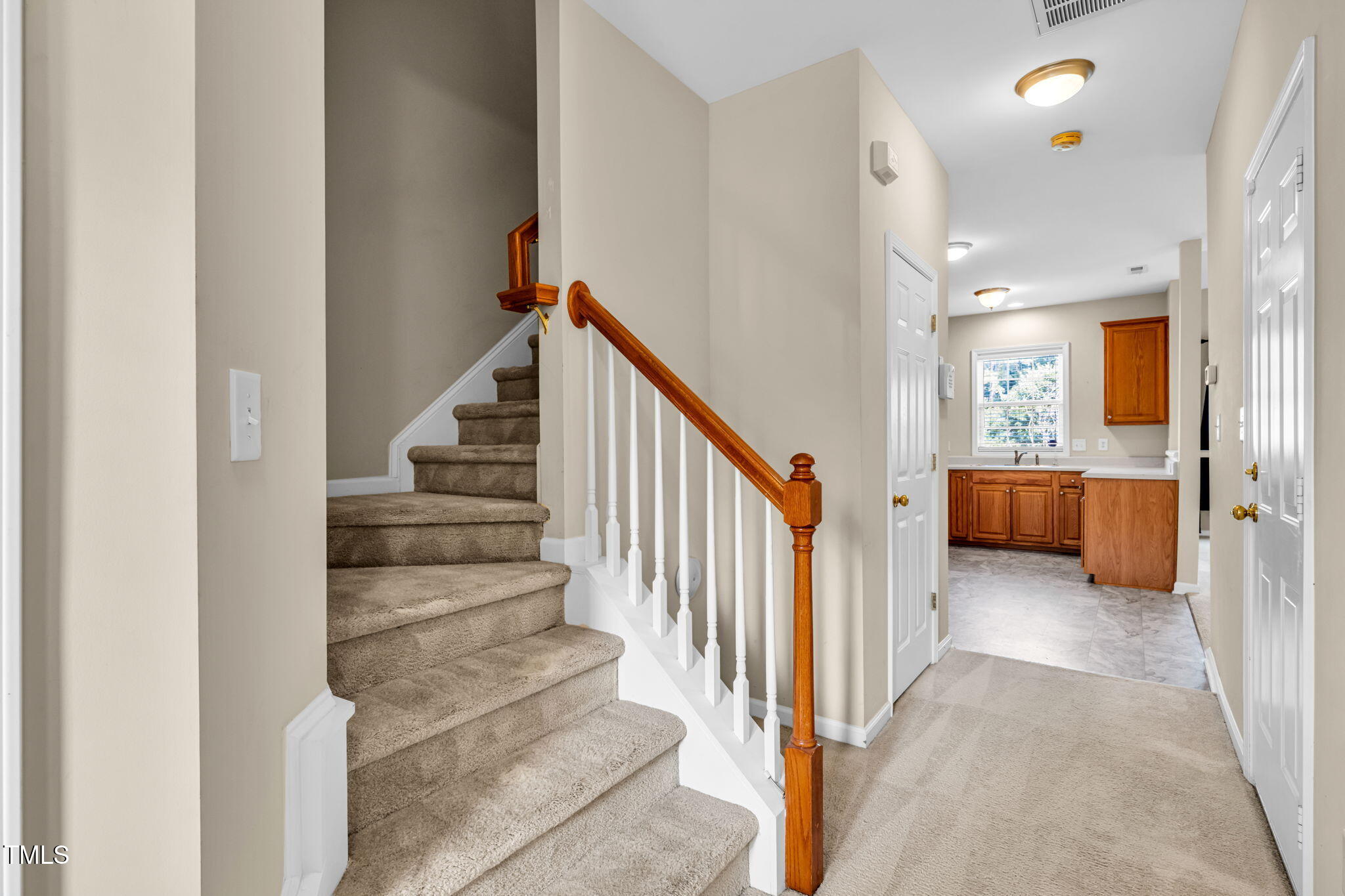 2737 Andover Glen Road Raleigh, NC 27604 - Photo 5 of 36 a view of a hallway with a livingroom and stairs