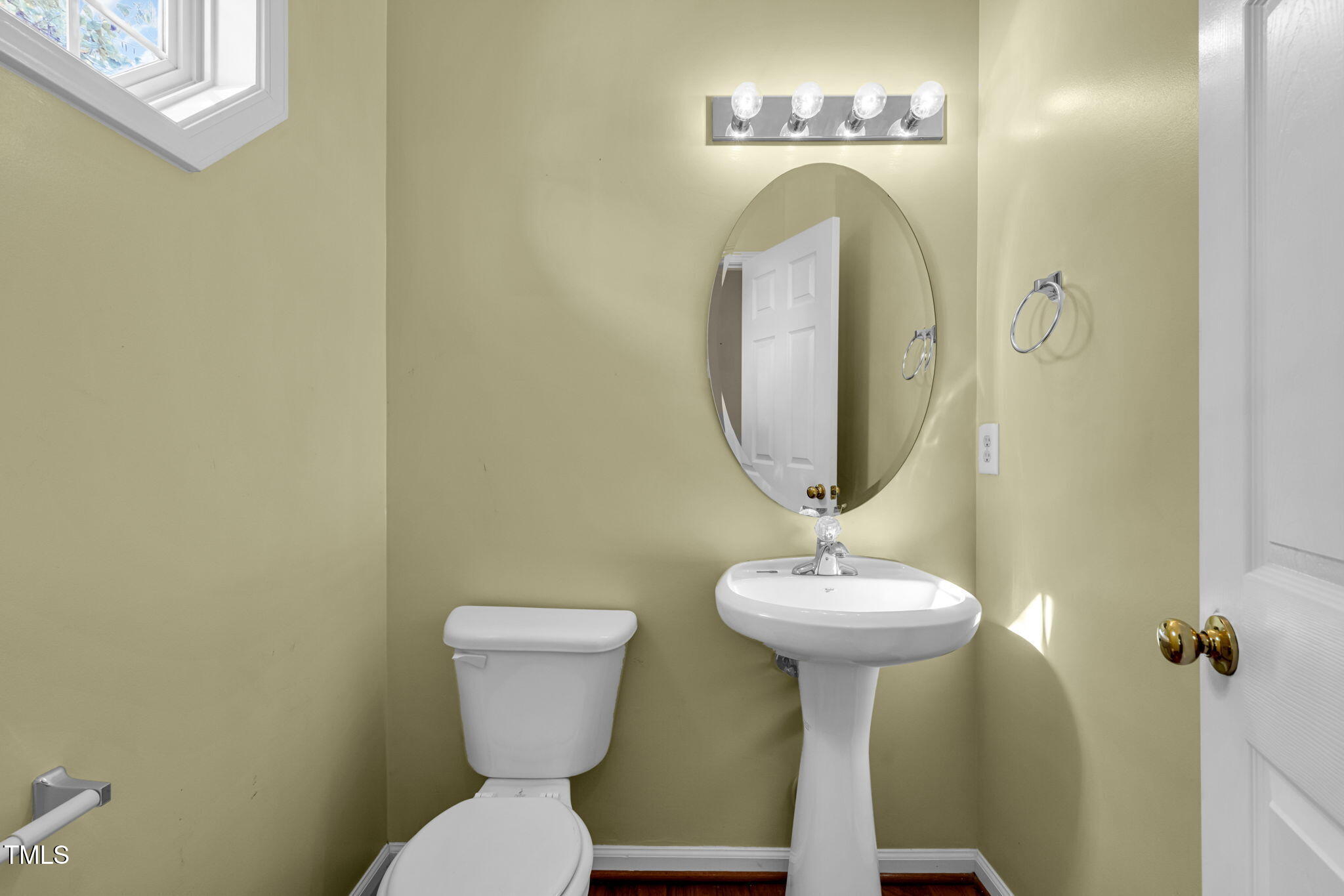 2737 Andover Glen Road Raleigh, NC 27604 - Photo 6 of 36 a bathroom with a toilet sink and mirror