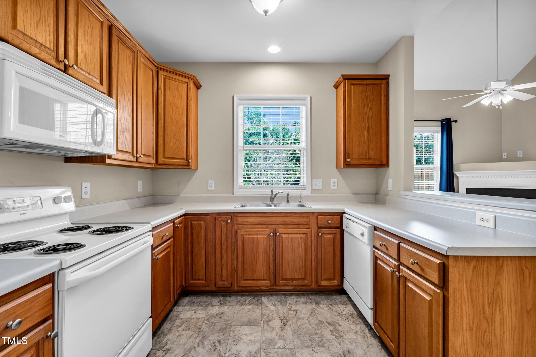 2737 Andover Glen Road Raleigh, NC 27604 - Photo 8 of 36 a kitchen with stainless steel appliances granite countertop wooden cabinets a sink and a stove