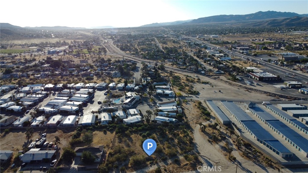 771 Scarvan Road Yucca Valley, CA 92284 - Photo 3 of 8 an aerial view of residential house with parking space