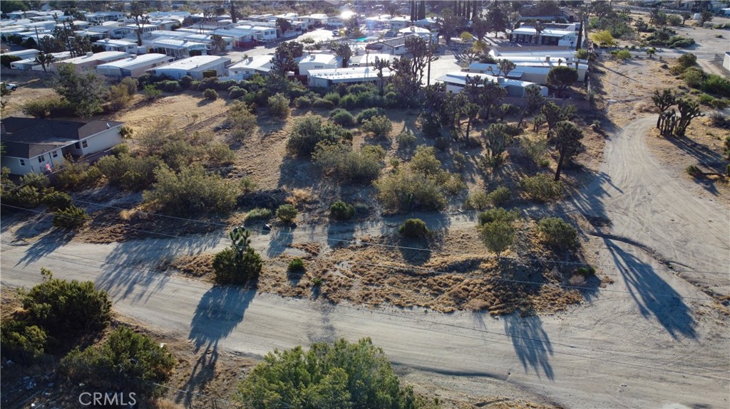 771 Scarvan Road Yucca Valley, CA 92284 - Photo 7 of 8 a aerial view of a house with a yard
