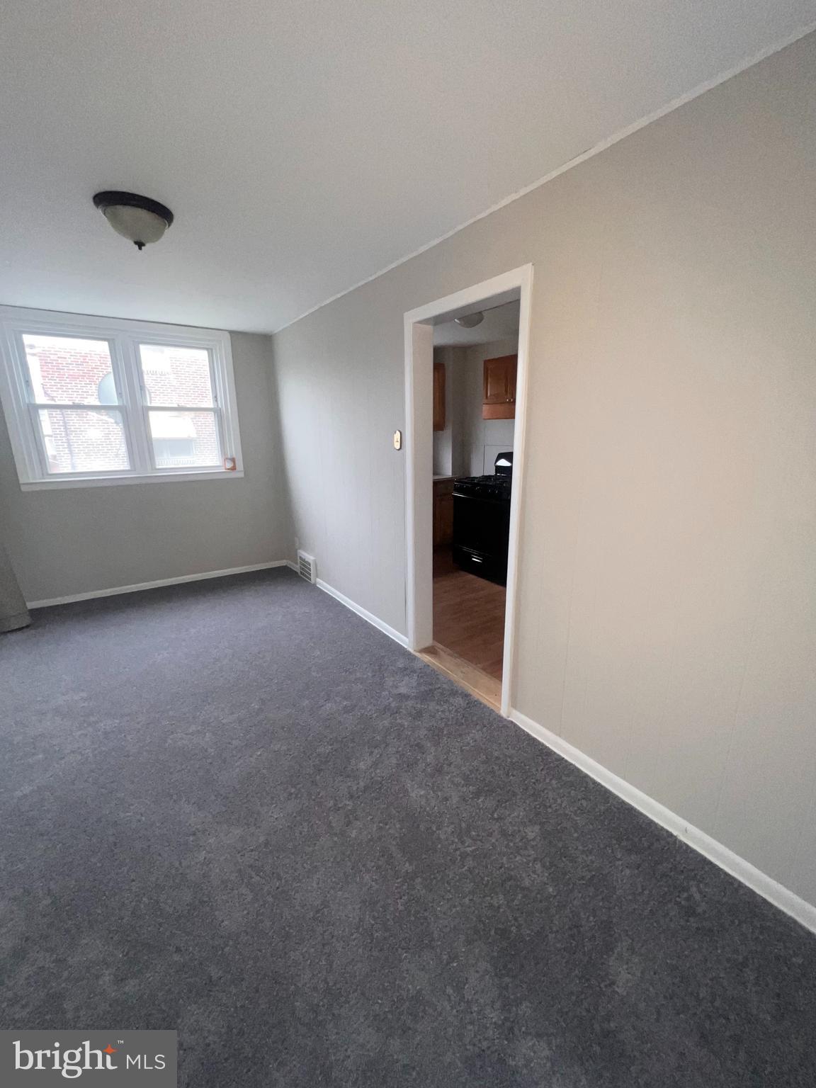 920 Butler Street Chester, PA 19013 - Photo 4 of 10 a view of an empty room with a window