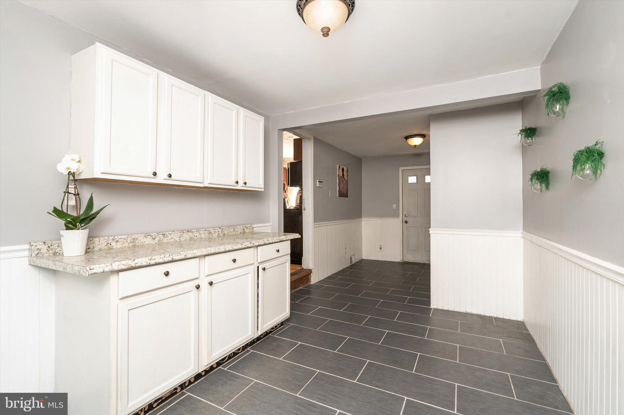 310 Pingree Avenue Ewing, NJ 08618 - Photo 13 of 28 a kitchen with granite countertop white cabinets and white appliances