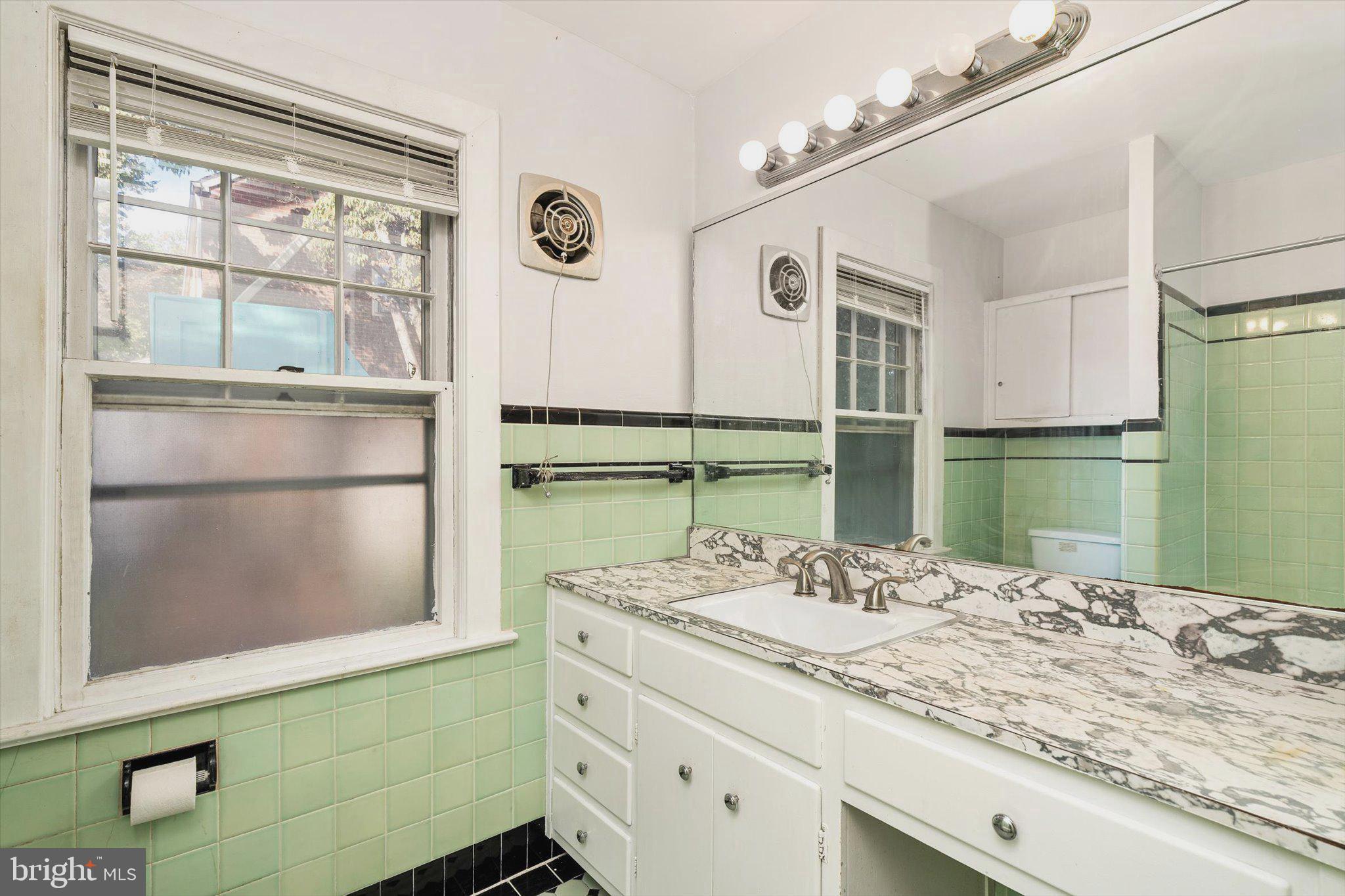 310 Pingree Avenue Ewing, NJ 08618 - Photo 15 of 28 a bathroom with a granite countertop sink and a mirror