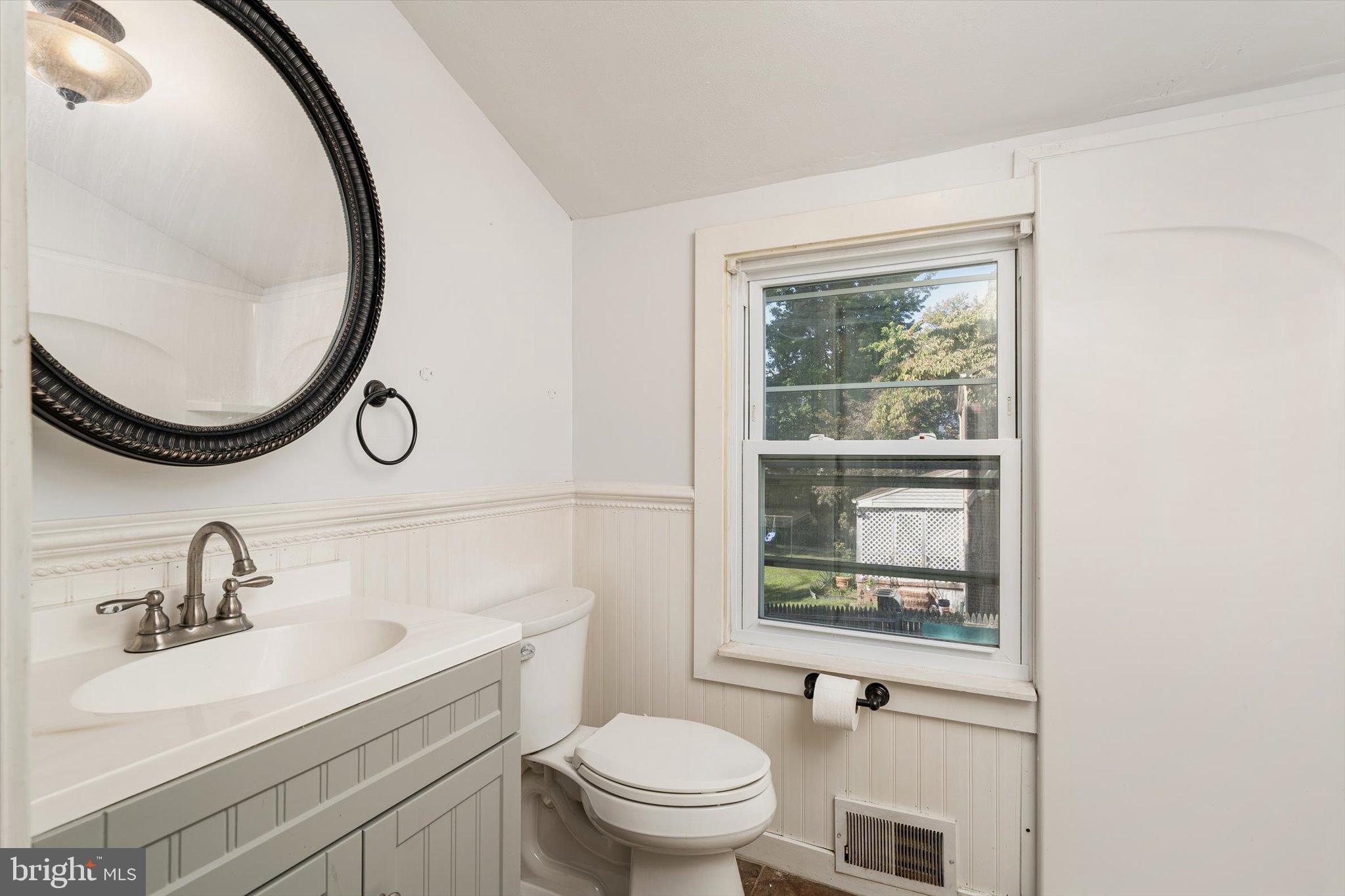 310 Pingree Avenue Ewing, NJ 08618 - Photo 18 of 28 a bathroom with a sink a toilet and a mirror