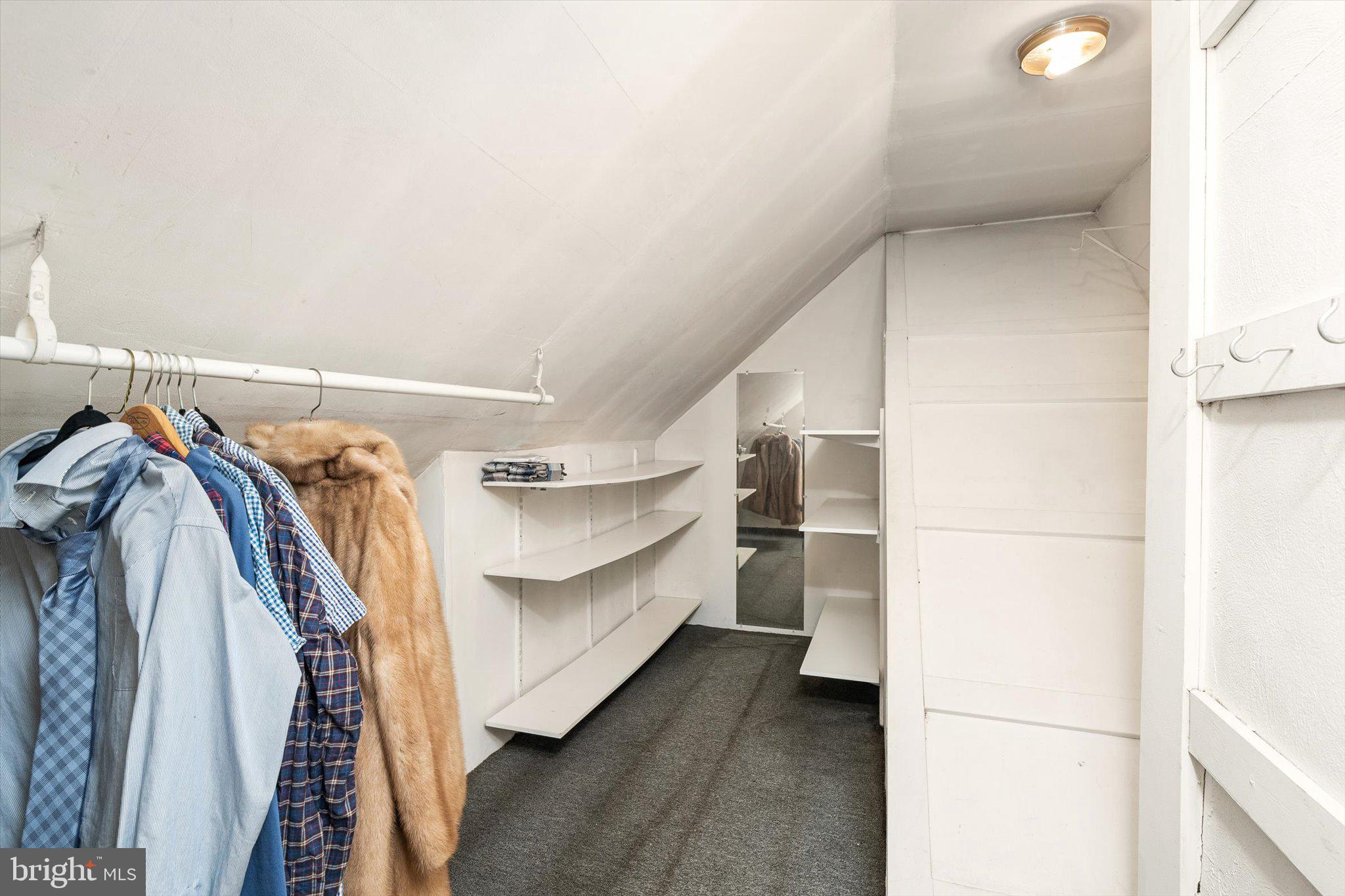 310 Pingree Avenue Ewing, NJ 08618 - Photo 21 of 28 a view of walk in closet with clothes and shoes