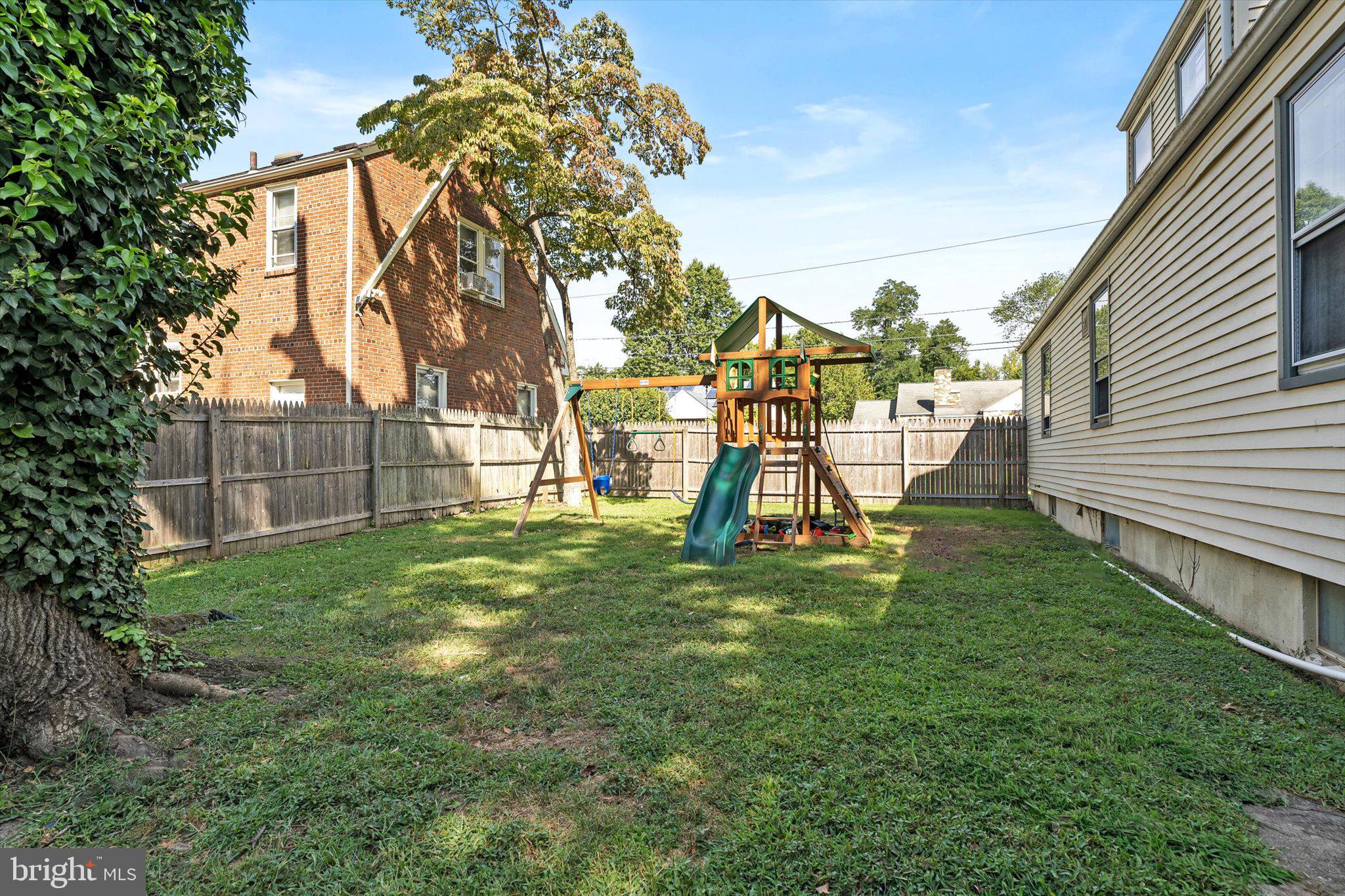 310 Pingree Avenue Ewing, NJ 08618 - Photo 23 of 28 a view of a yard with a slide