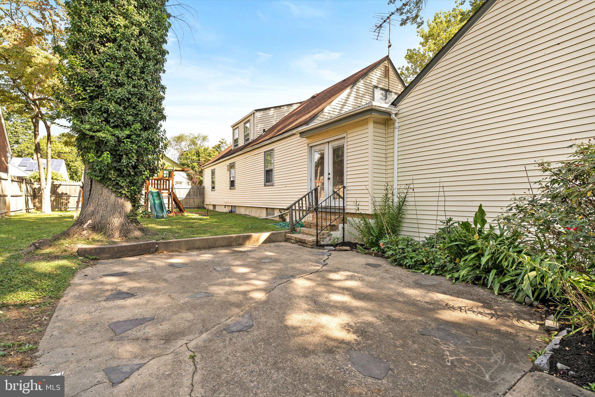 310 Pingree Avenue Ewing, NJ 08618 - Photo 24 of 28 a view of a house with backyard and a tree