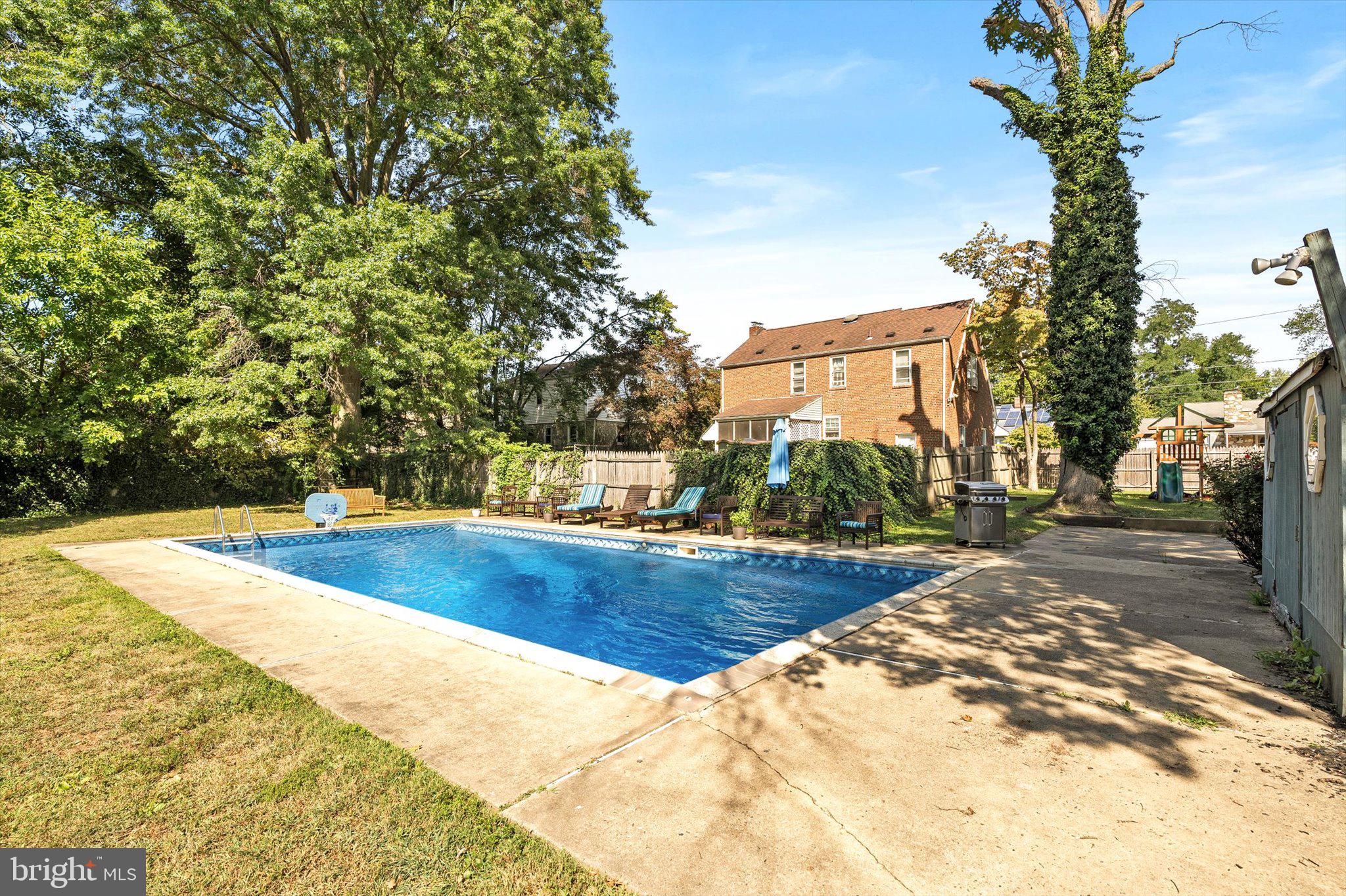 310 Pingree Avenue Ewing, NJ 08618 - Photo 28 of 28 a view of a swimming pool with a yard