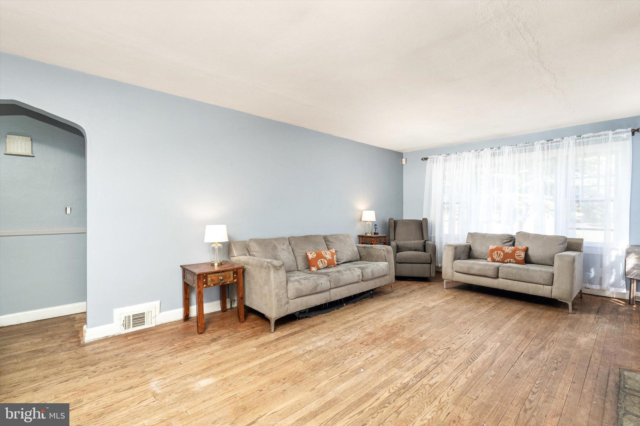 310 Pingree Avenue Ewing, NJ 08618 - Photo 7 of 28 a living room with furniture and a wooden floor