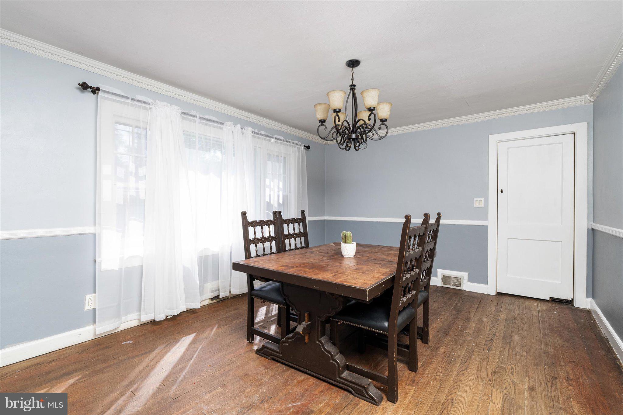 310 Pingree Avenue Ewing, NJ 08618 - Photo 9 of 28 a view of a dining room with furniture and wooden floor