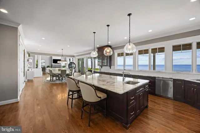 a large kitchen with a table and chairs