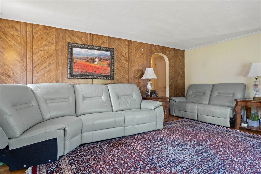 4 Merrow Lane Stoneham, MA 02180 - Photo 13 of 33 a living room with furniture and a couch