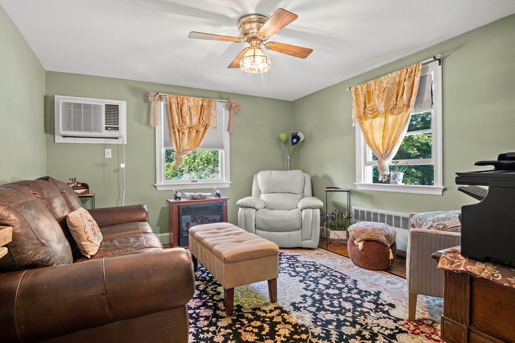 4 Merrow Lane Stoneham, MA 02180 - Photo 15 of 33 a living room with furniture and a window