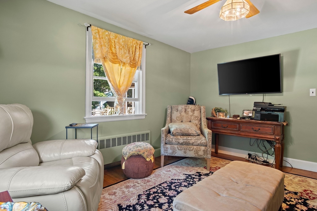 4 Merrow Lane Stoneham, MA 02180 - Photo 16 of 33 a living room with furniture and a flat screen tv