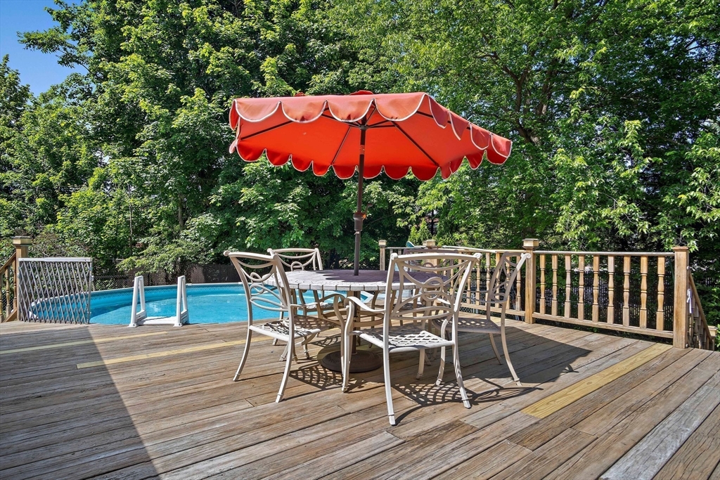 4 Merrow Lane Stoneham, MA 02180 - Photo 26 of 33 a view of a wooden deck with furniture
