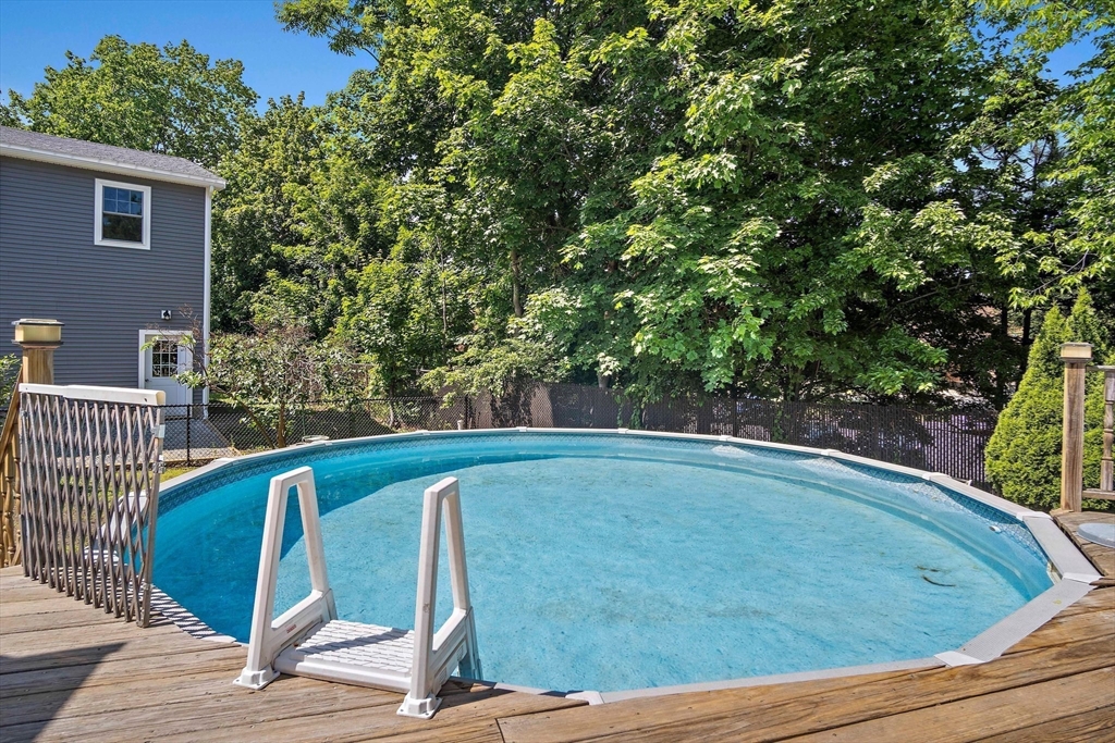 4 Merrow Lane Stoneham, MA 02180 - Photo 28 of 33 a view of a swimming pool with an outdoor seating