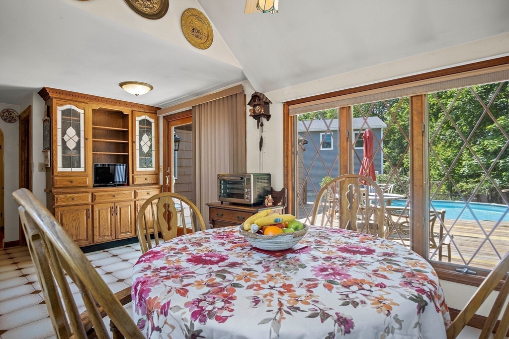 4 Merrow Lane Stoneham, MA 02180 - Photo 8 of 33 a bedroom with a bed and large windows