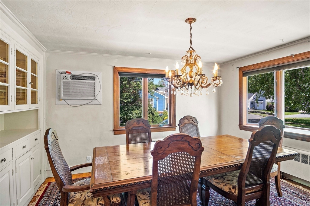 4 Merrow Lane Stoneham, MA 02180 - Photo 10 of 33 a view of a dining room with furniture window and outside view