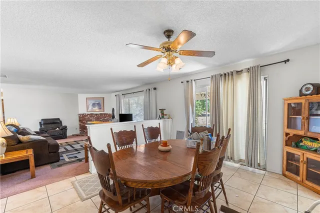 a view of a dining room with furniture and a window